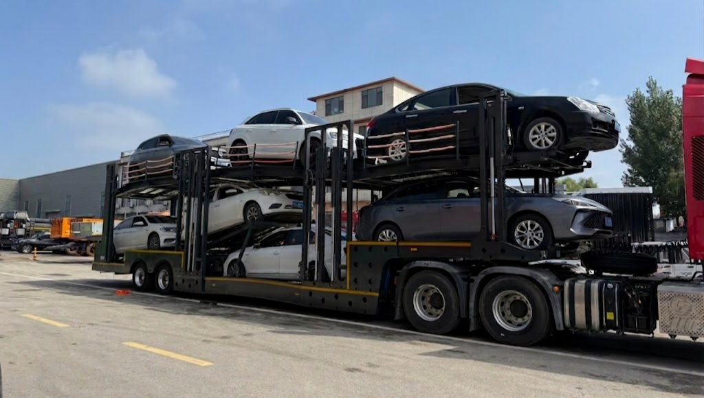 HUAYUE heavy-duty car carrier trailer fully loaded with 7 passenger cars in real-world operation