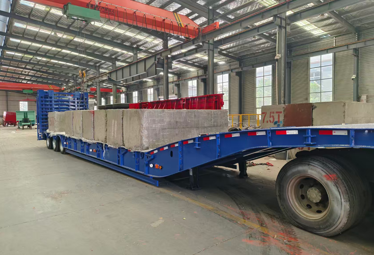 HUAYUE 3-axle lowbed trailer undergoing extreme dynamic load testing with 5T and 7.5T concrete blocks to verify yield strength limits.