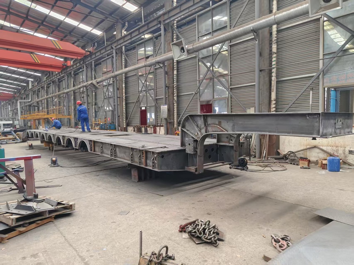8-axle lowbed trailer structure in a workshop during the welding stage